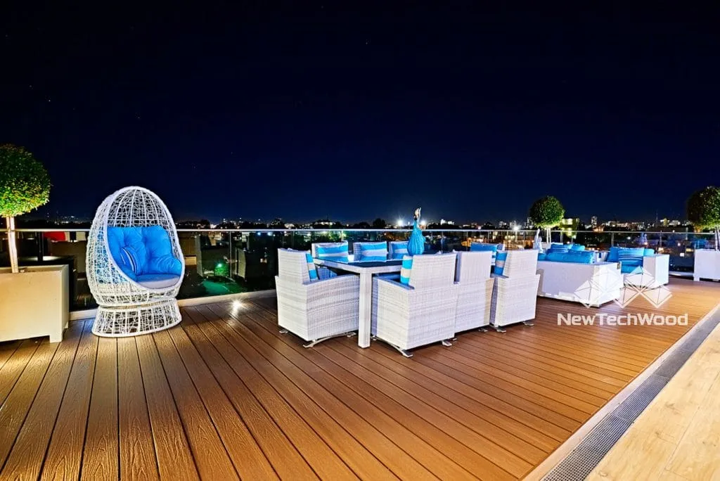 NewTechWood composite decking on a rooftop terrace at night