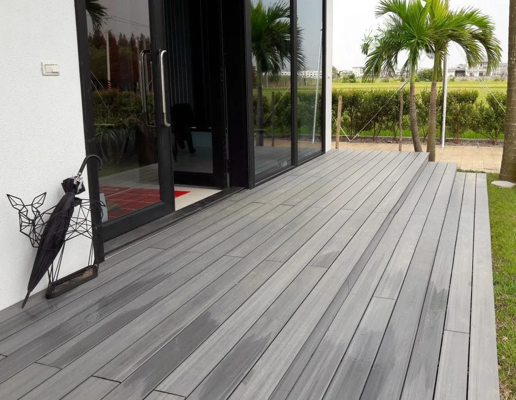 Grey boards along a glass-walled living room