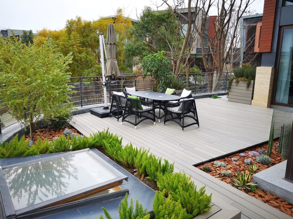 Rooftop dining terrace above the treeline