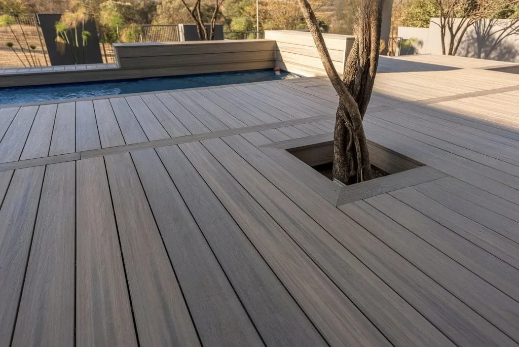 Boards cut around a mature tree