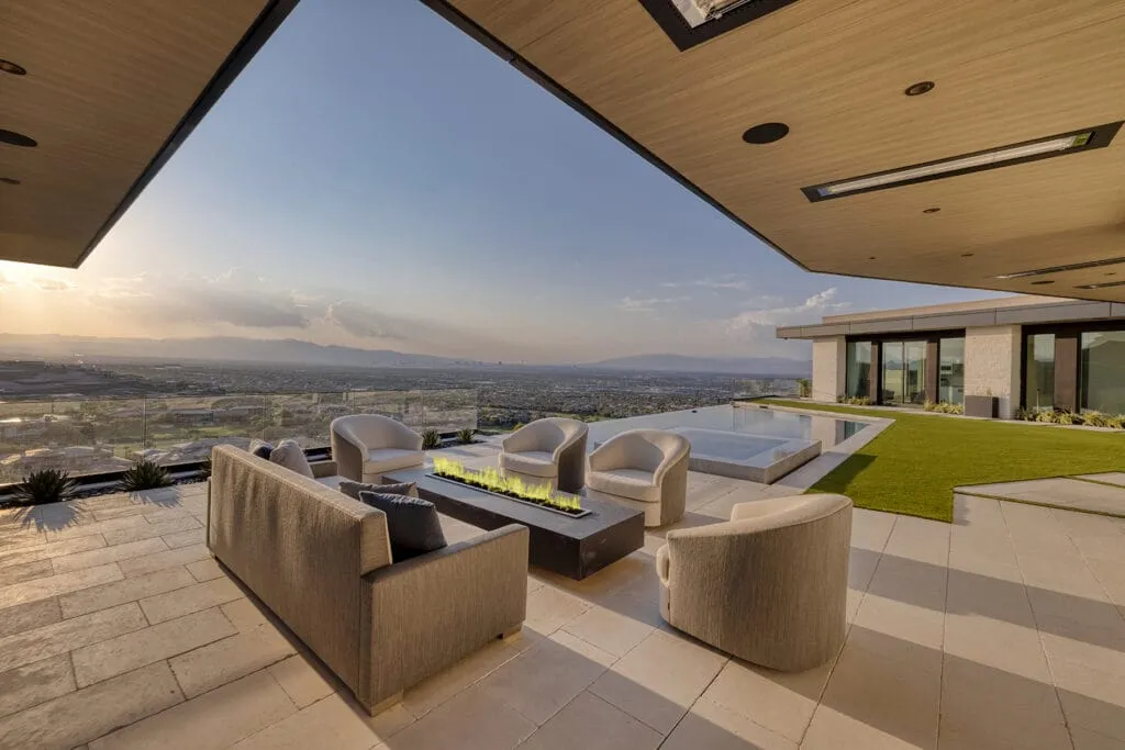 Rooftop lounge above the water at dusk