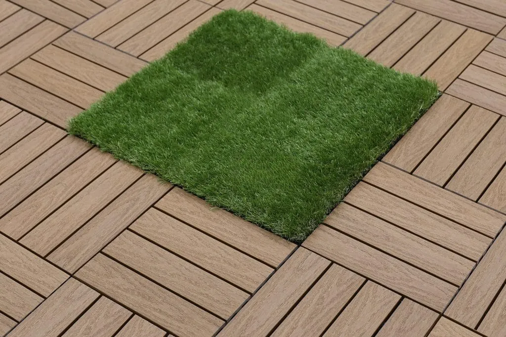 Deck tiles laid around an artificial-turf inset