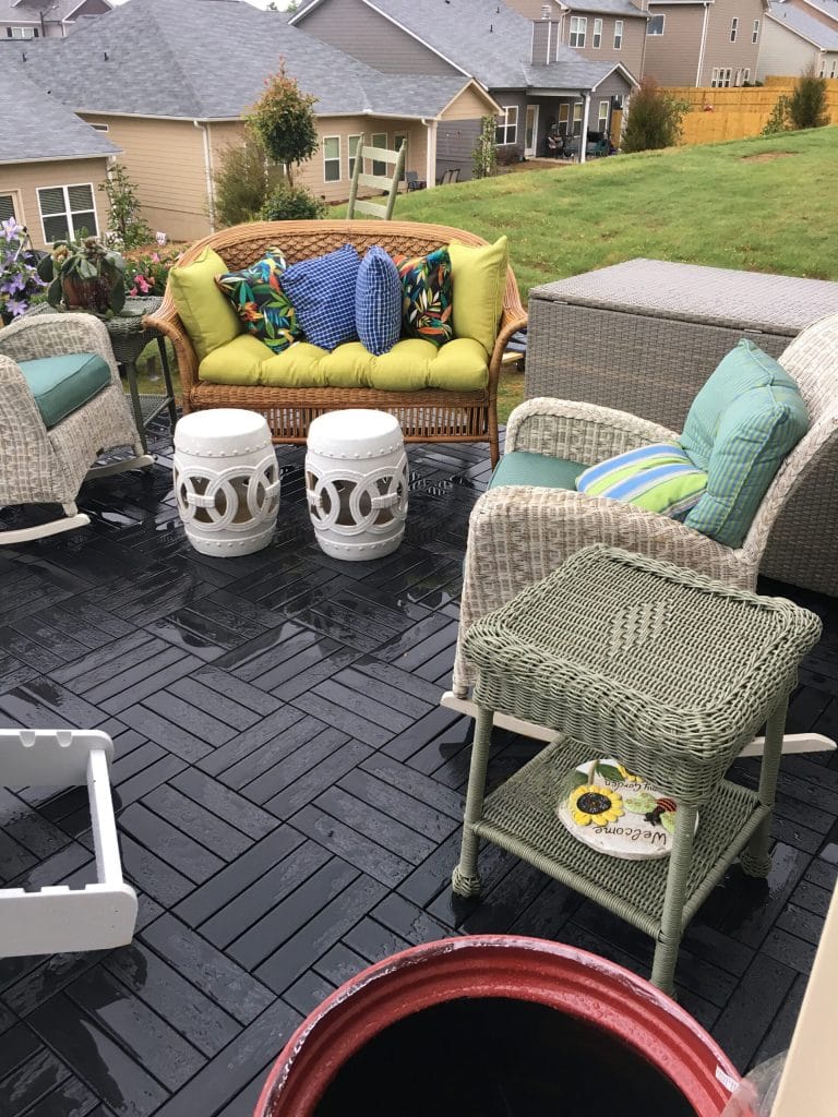 Patio furniture set on interlocking deck tiles