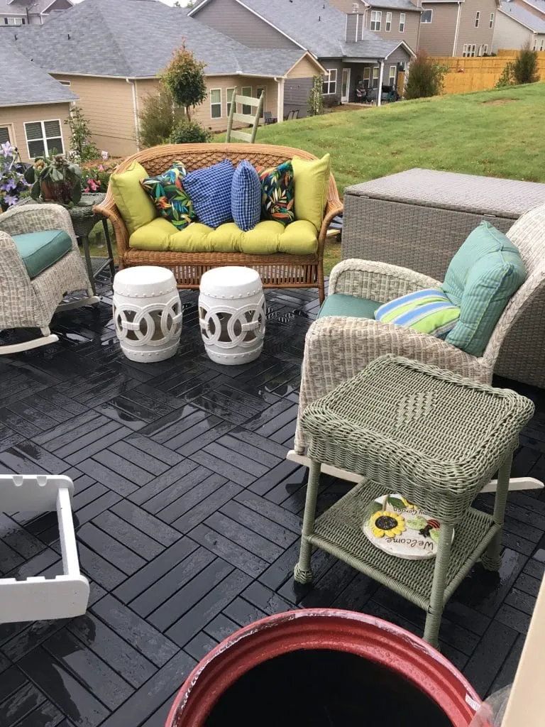 Patio furniture set on interlocking deck tiles