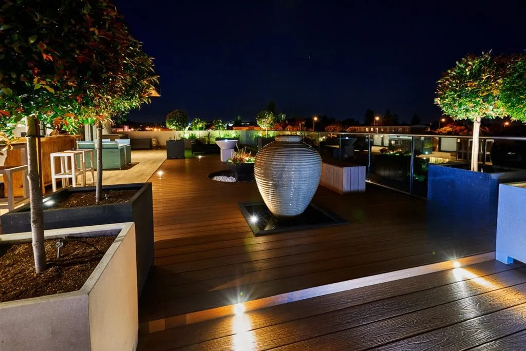 Waterfront deck lit for the evening