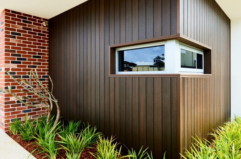Vertical cladding against exposed brick