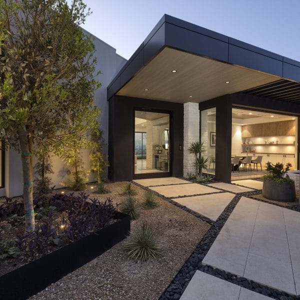 Modern home entry courtyard at dusk