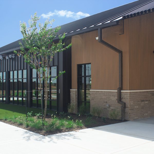 NewTechWood board and batten composite siding on a building exterior