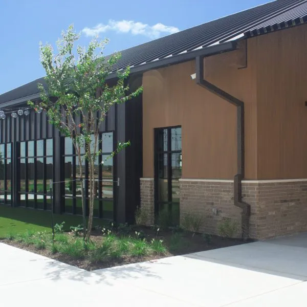 NewTechWood board and batten composite siding on a building exterior